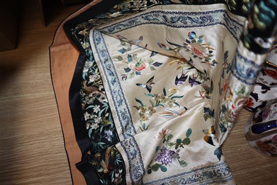 A Chinese silk embroidered hanging and a collection of embroidered sleeve bands and panels